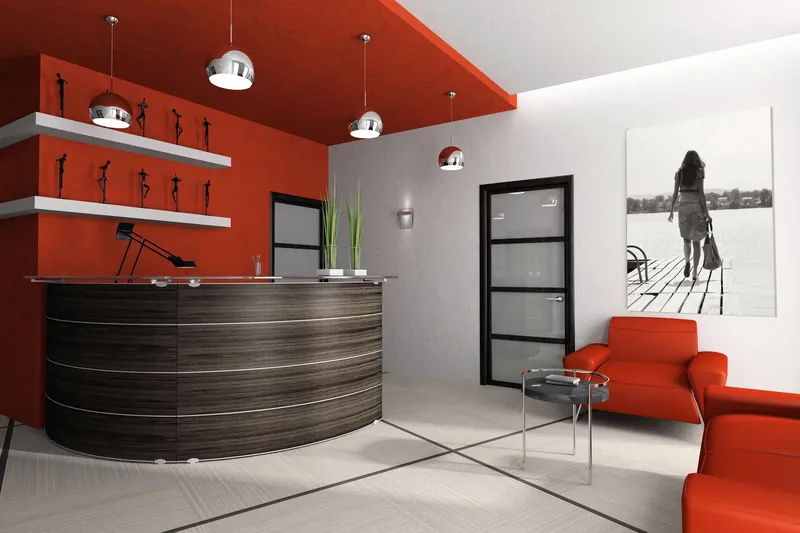Lobby with a coral feature wall behind the front desk